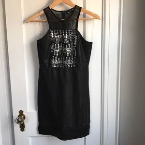 Black bodycon dress with front embellishment